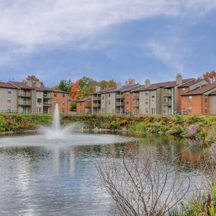 lush grounds with pond  at hunt club apartments, copley, 44321