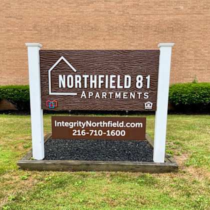 a sign for northfield 81 apartments in front of a building