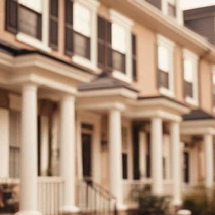 a row of brown houses with white columns.