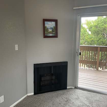 a picture frame is hanging on the wall in a room.