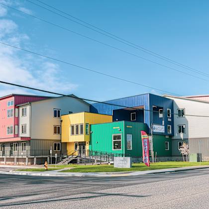 a row of colorful houses on the side of a street