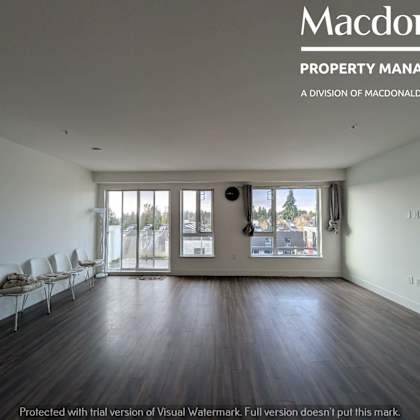 a room with a macdonald property management logo on the wall.