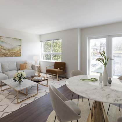 a living room with white walls and hardwood floors
