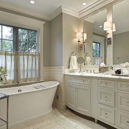 a bathroom with a bathtub and two sinks