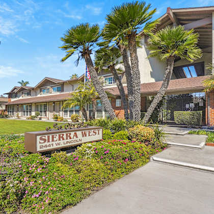 a sign that says sierra west in front of a building.
