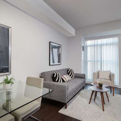 a living room with a couch and a glass table