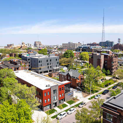 a cityscape with a mix of residential and commercial buildings.