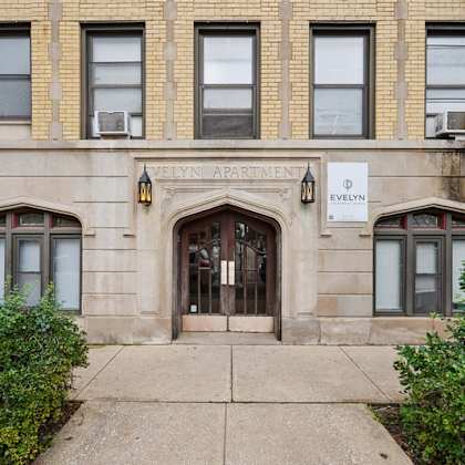 the front of the evelyn apartment building is shown.