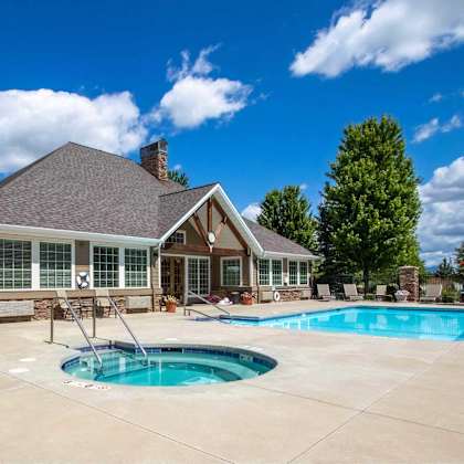 a house with a pool in the backyard.