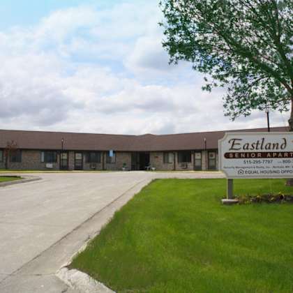 a sign for eastland park is in front of a building.