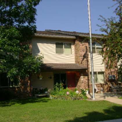 a house with a flag pole in front of it.