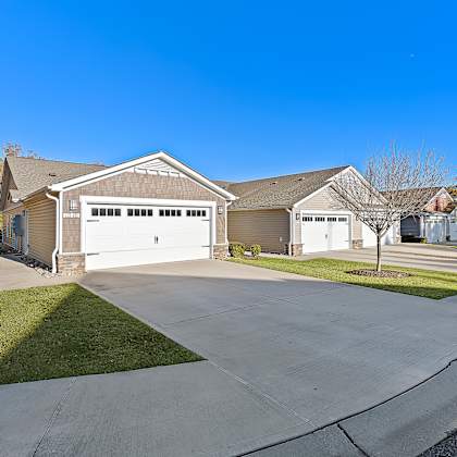 a two-car garage is attached to a house.