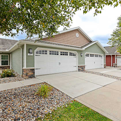 a house with a green garage door.