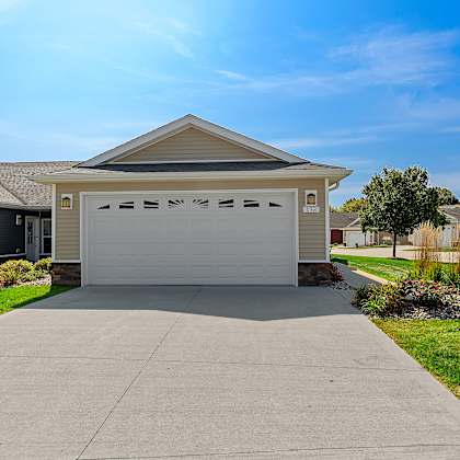 a house with a garage door that says "b33" on it.