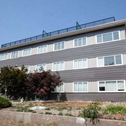 a large building with a balcony on top of it