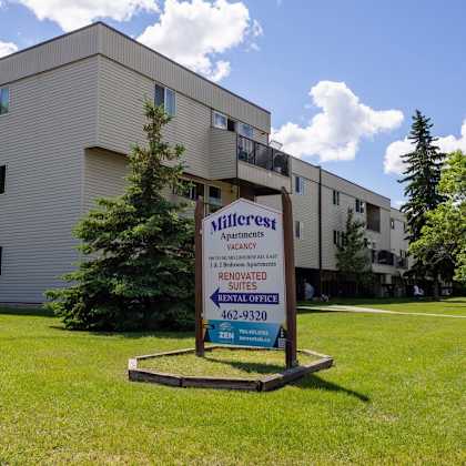 a sign in front of a building advertises the millerest apartments.