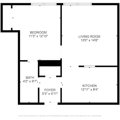 a floor plan of a house with a bedroom, living room, kitchen, and bath.