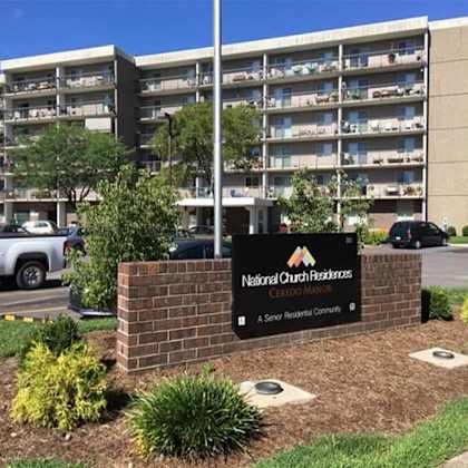 the sign in front of the building says national church residences.