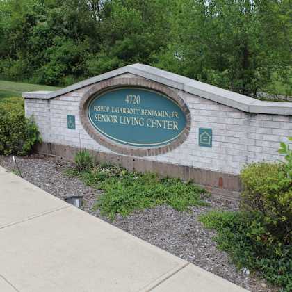 a sign for the bishop carrothers benjamín jr. senior living center is displayed.