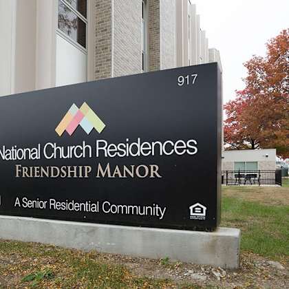 a sign for national church residences friendship manor.