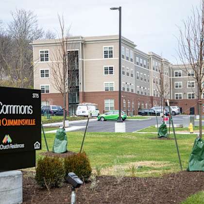 the sign in front of the building says the corners at south cumminsville.