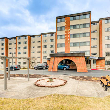 a large brick building with the words bethany house on the side.