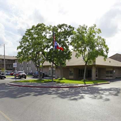 a flag is flying in front of a building.