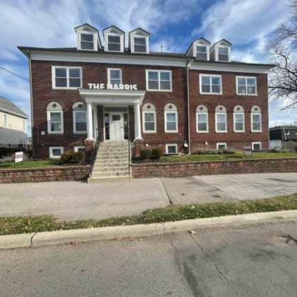 a red brick building with the name "the habrick" on the front.