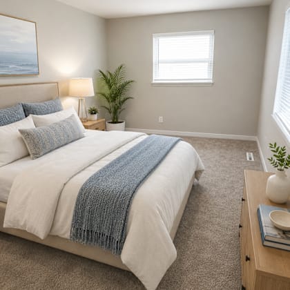 a bedroom with a large bed and a window.