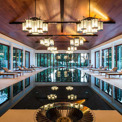 a large pool with a large chandelier hanging from the ceiling