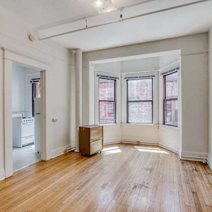a room with wooden floors and white walls at clay & tiffany, portland, 97201