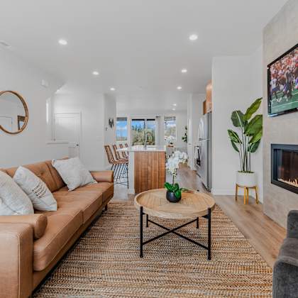 living room with a fireplace and a television at thrive at green mountain, camas