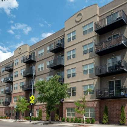 a large apartment building on the corner of a street  at kedzie 4447, chicago, il