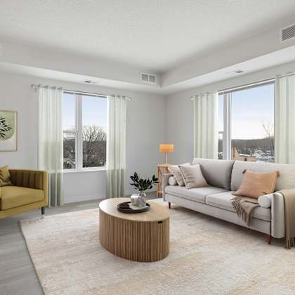 the living room of an apartment with a couch and a table