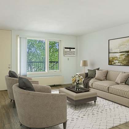 a living room with a couch and two chairs at humboldt senior 55+ apartments, saint paul, minnesota