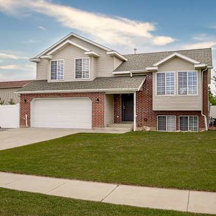 a house with a garage and a driveway.