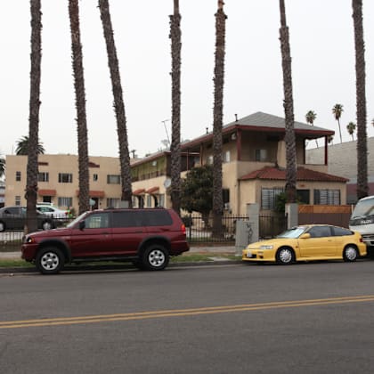 a group of cars parked on the side of a street