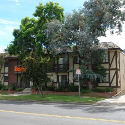 an apartment building on the corner of a street