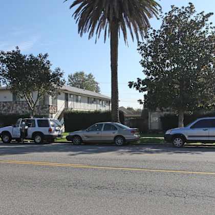 a group of cars parked on the side of a street