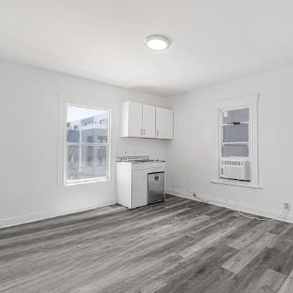 a kitchen area with a dishwasher and a refrigerator.