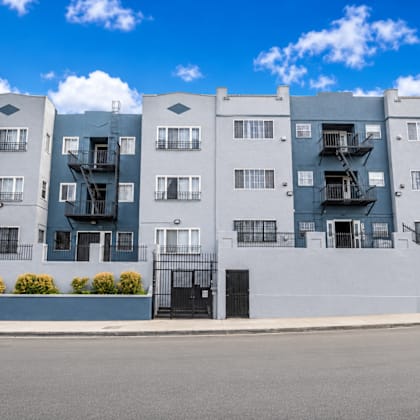 a modern apartment building with balconies and staircases.