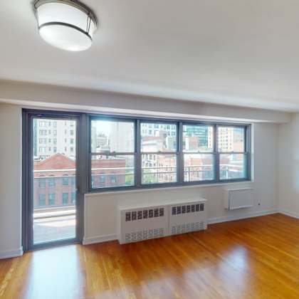 a room with a window overlooking a cityscape.