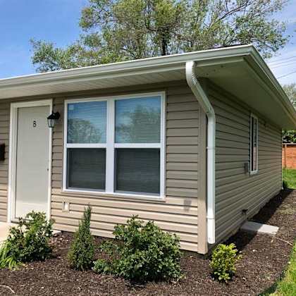 a duplex building with a window