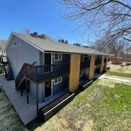 building view with a deck and staircase