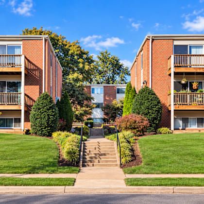 brick apartment buildings with balconies and landscaped courtyard at the wyman hills ahr llc apartments, baltimore, 21211