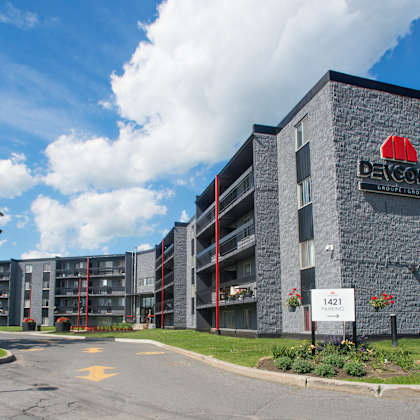 a large building with a red sign on it that says "bayshore".