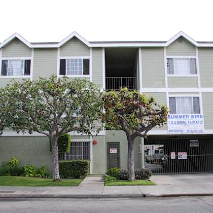 a two story building with a sign that says