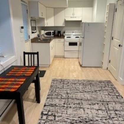 a kitchen with a table and chairs in it.