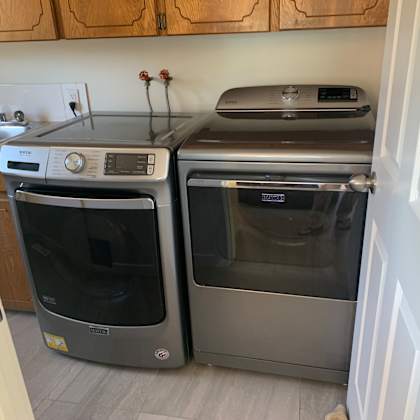 a black dishwasher is next to a black oven.