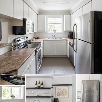a kitchen with a black fridge and white cabinets.